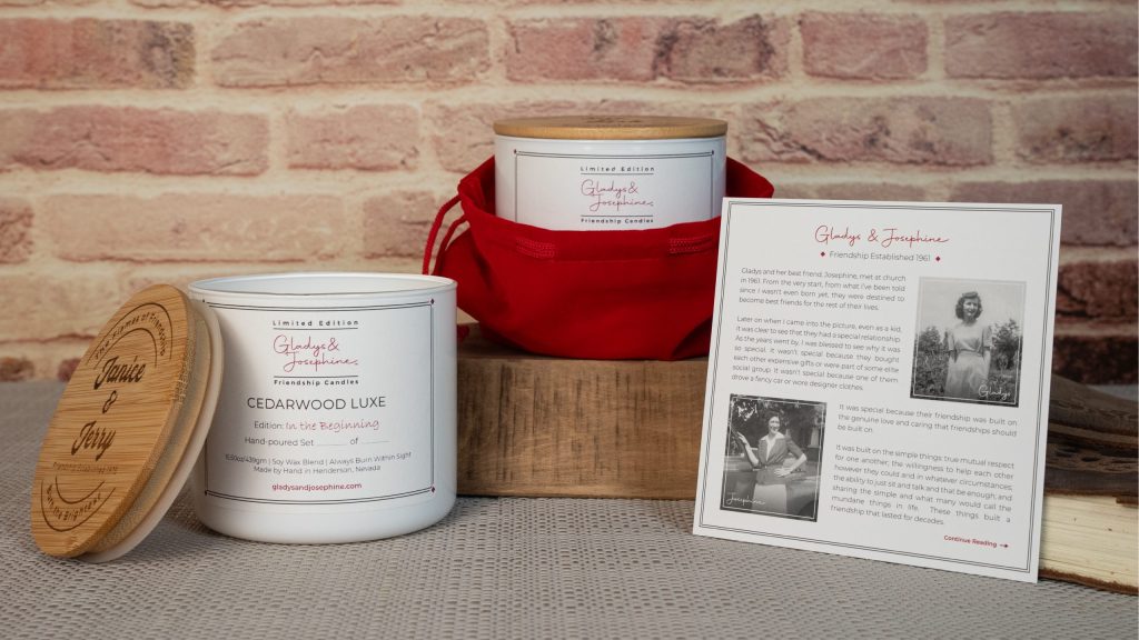 Candles positionsed in a red velvet bag sitting atop a wooden box arranged to show the candles and the story of gladys and josephine.